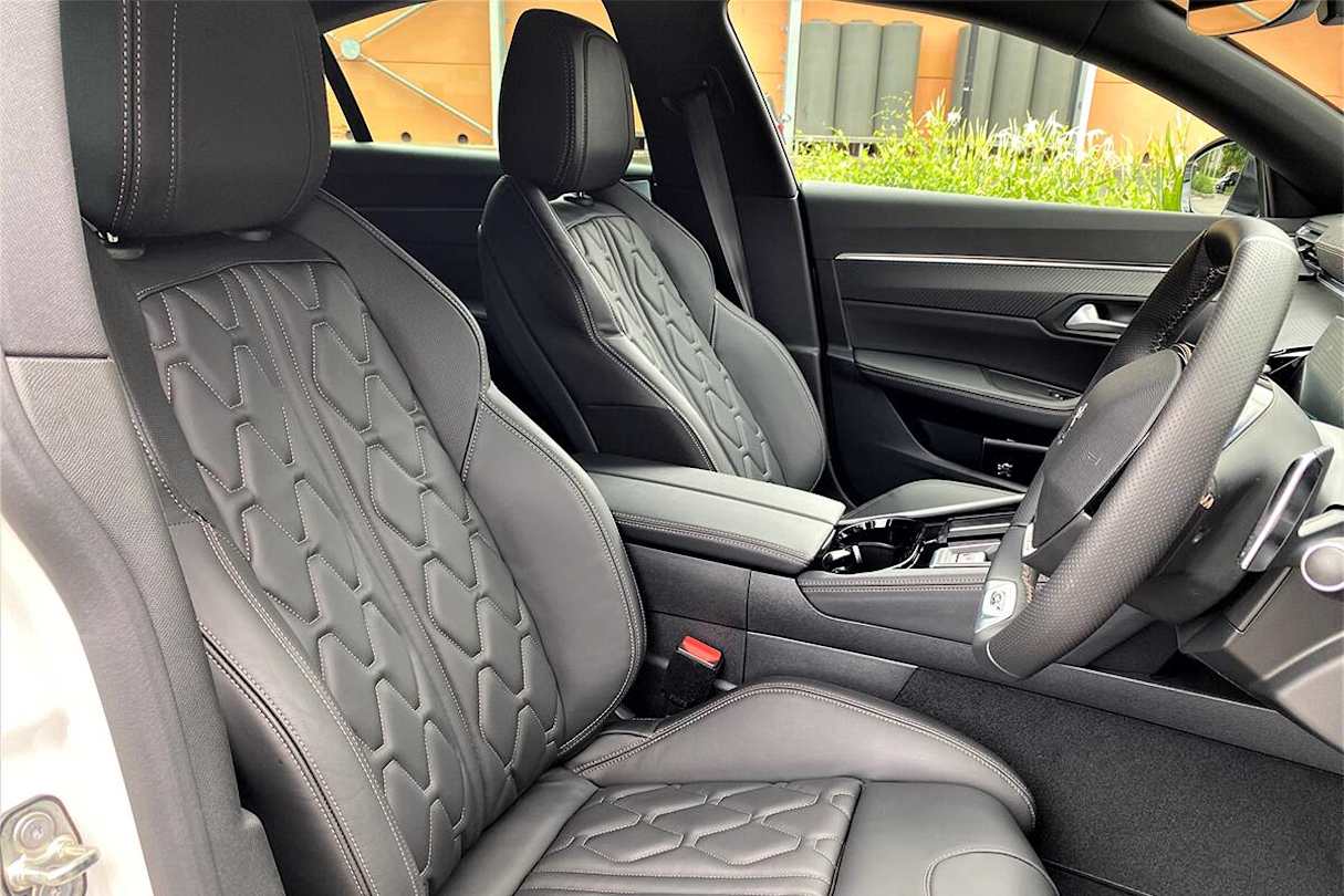 Peugeot has been generous with storage and the flip-top panel next to the shifter is a good example of that. (Image: Richard Berry)